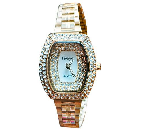 Gold and diamond studded wedding watch for ladies.